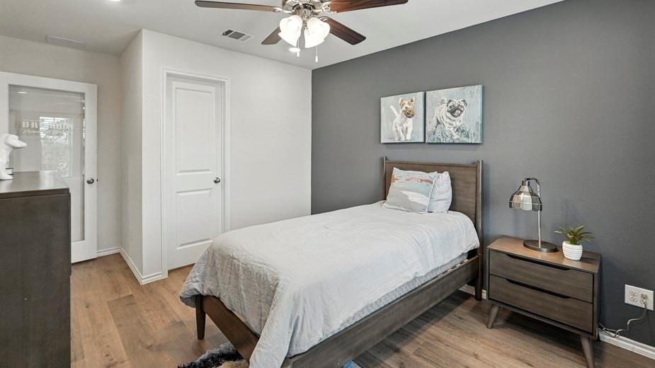 1911 Reveille Way Terrell, TX 75160 - Photo 32 of 39 Bedroom featuring light wood finished floors and a ceiling fan