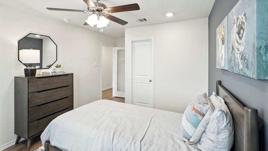 1911 Reveille Way Terrell, TX 75160 - Photo 33 of 39 Bedroom with ceiling fan, recessed lighting, and dark wood-type flooring