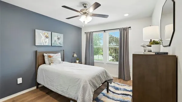 a bedroom with a bed and a mirror