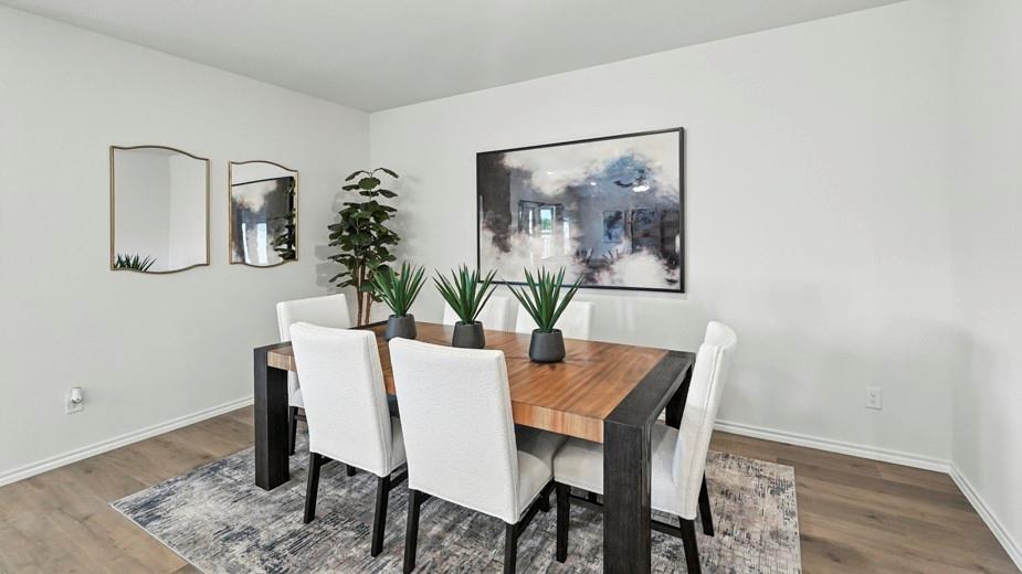 1911 Reveille Way Terrell, TX 75160 - Photo 7 of 39 Dining room featuring baseboards and wood finished floors
