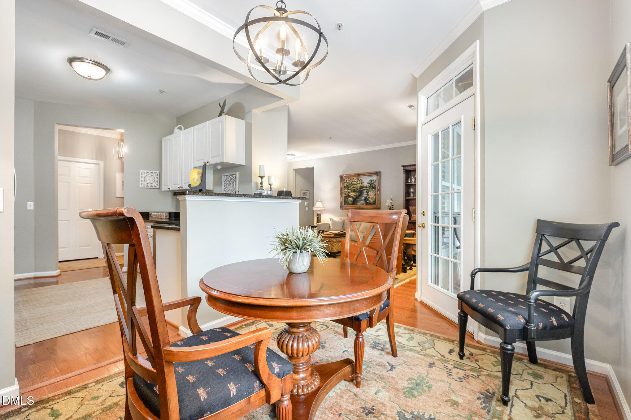 3121 Hemlock Forest Circle, Unit 203 Raleigh, NC 27612 - Photo 11 of 33 a dining room with a wooden table and chairs