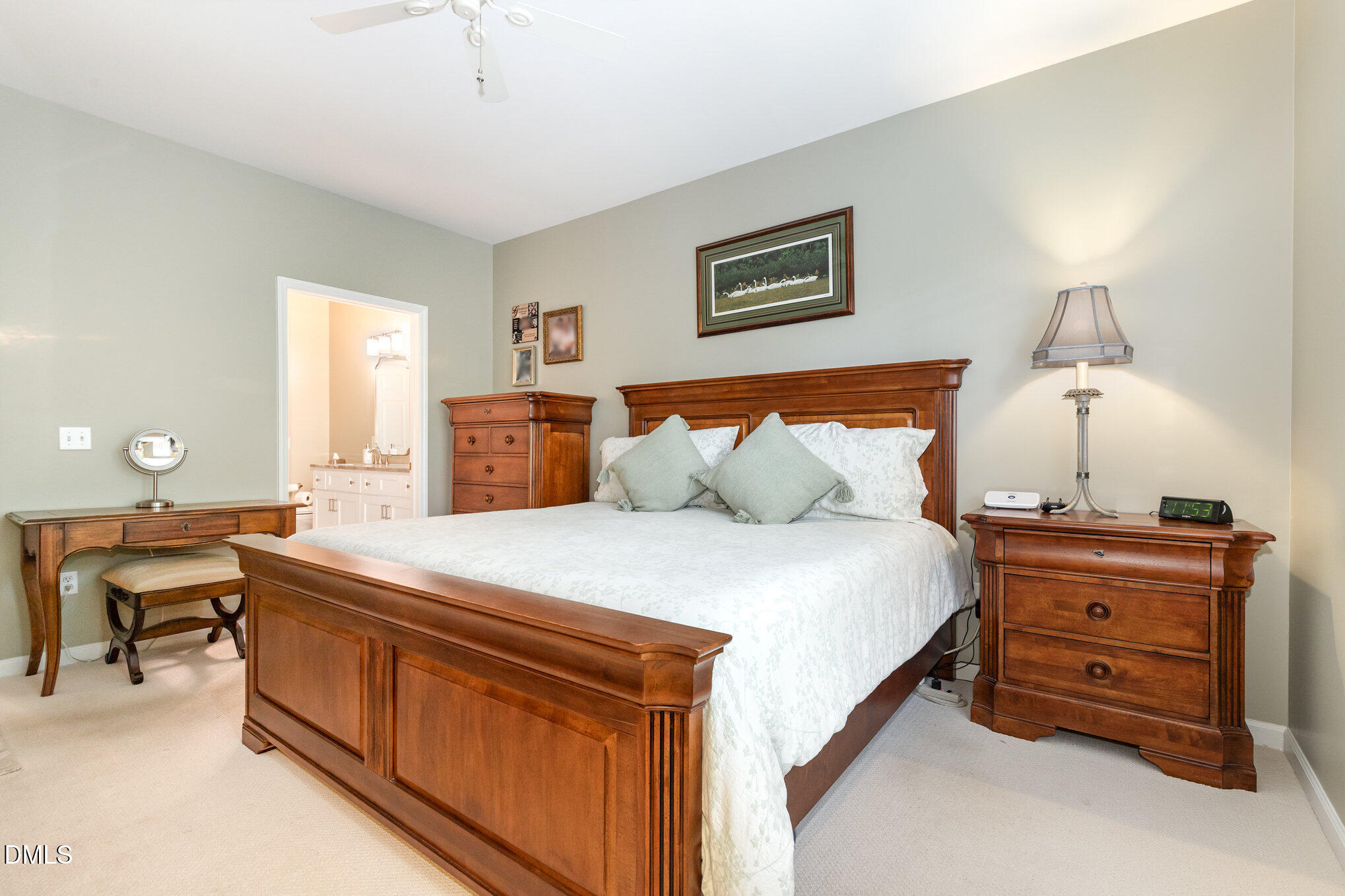 3121 Hemlock Forest Circle, Unit 203 Raleigh, NC 27612 - Photo 16 of 33 a bedroom with a bed and a table