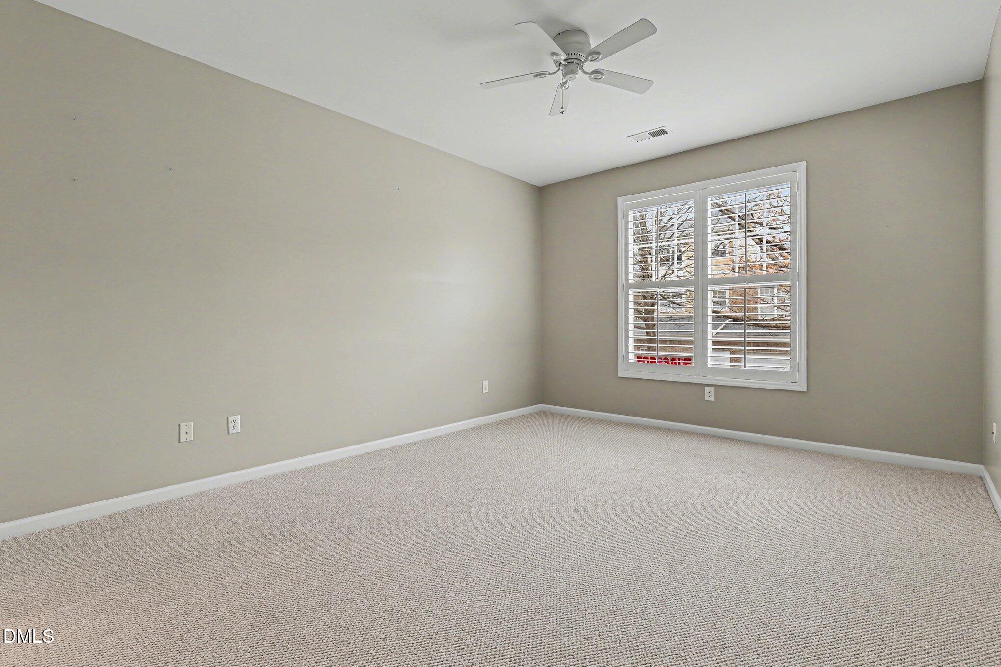 3121 Hemlock Forest Circle, Unit 203 Raleigh, NC 27612 - Photo 17 of 33 a view of an empty room with a window