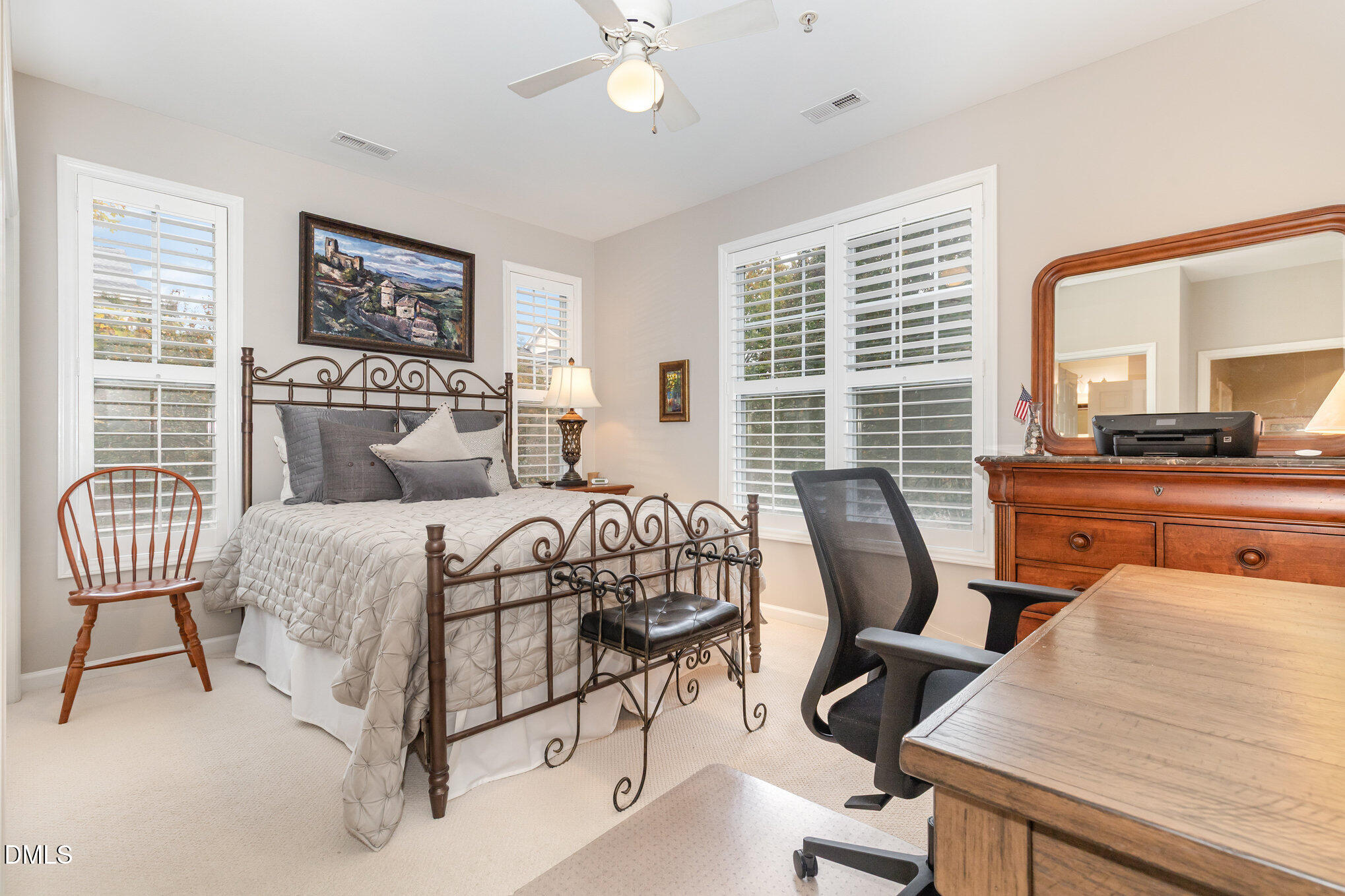 3121 Hemlock Forest Circle, Unit 203 Raleigh, NC 27612 - Photo 20 of 33 a bedroom with a bed chairs and table