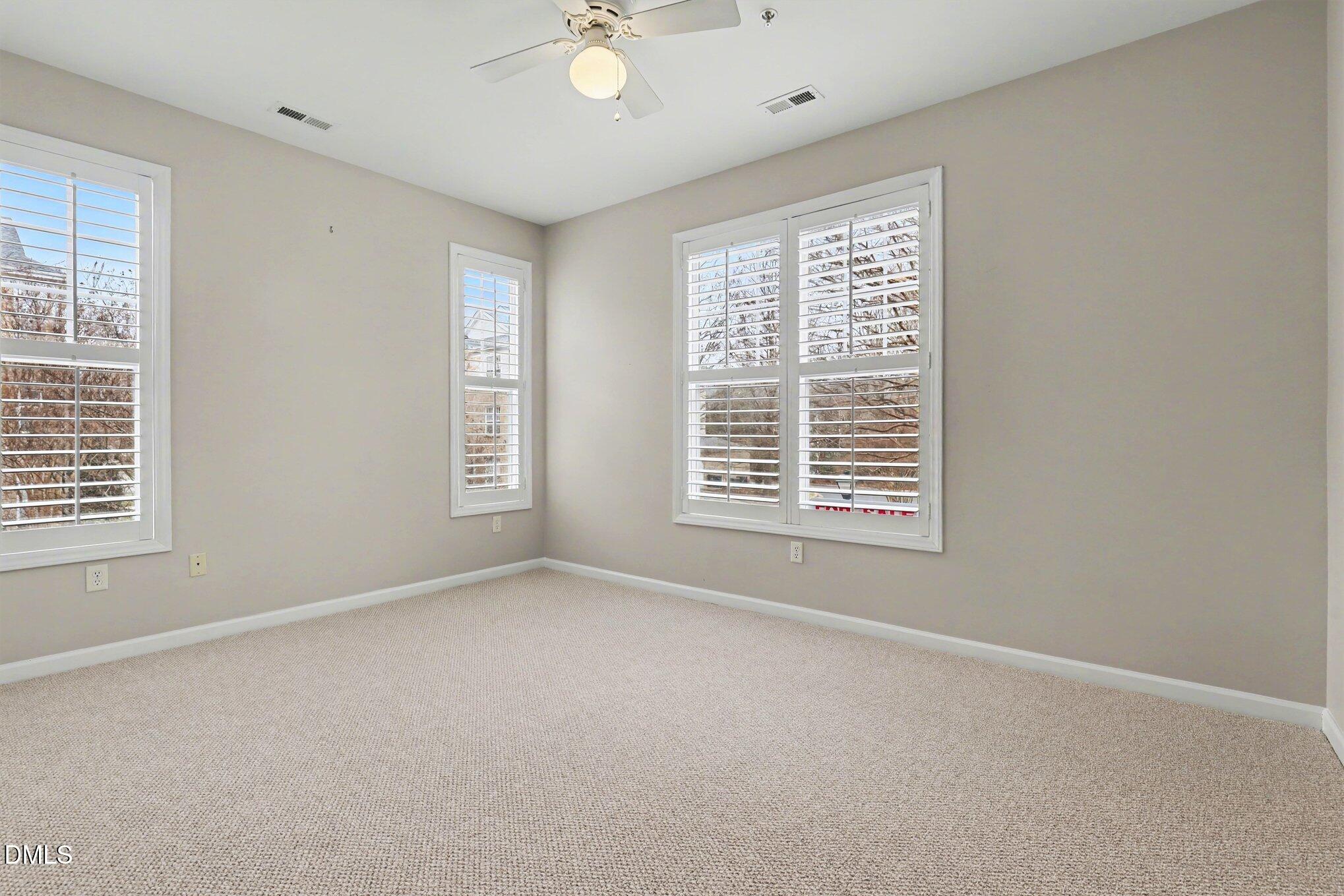 3121 Hemlock Forest Circle, Unit 203 Raleigh, NC 27612 - Photo 21 of 33 a view of an empty room with a window