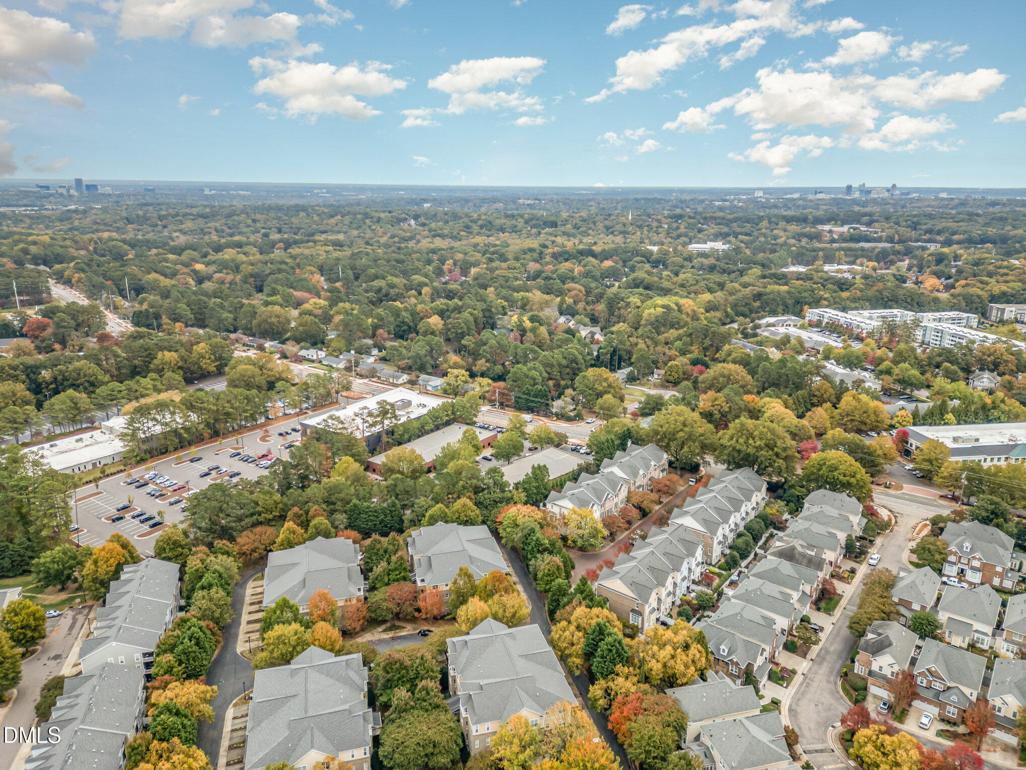 3121 Hemlock Forest Circle, Unit 203 Raleigh, NC 27612 - Photo 30 of 33 an aerial view of residential building with green space