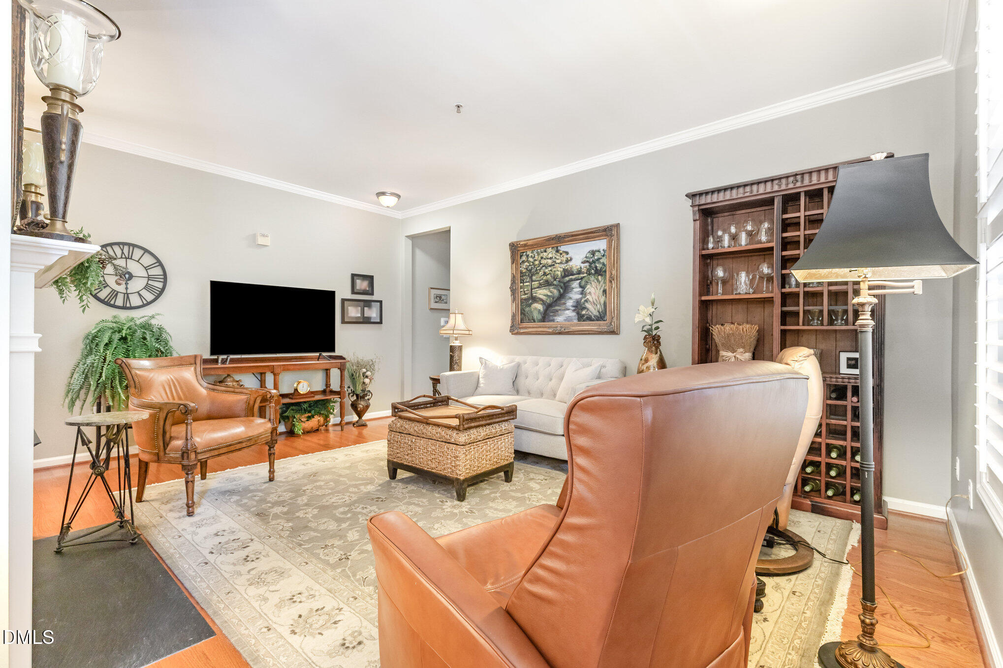 3121 Hemlock Forest Circle, Unit 203 Raleigh, NC 27612 - Photo 5 of 33 a living room with furniture and a flat screen tv