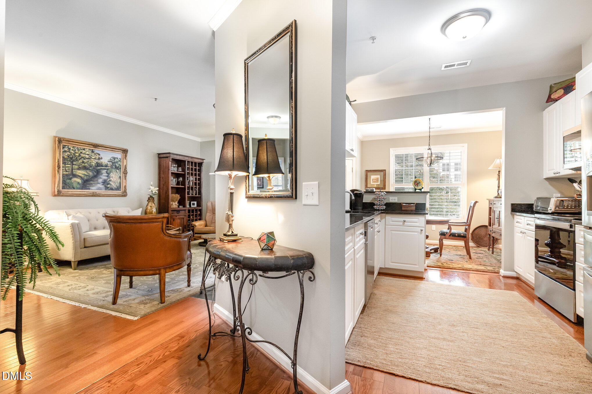 3121 Hemlock Forest Circle, Unit 203 Raleigh, NC 27612 - Photo 7 of 33 a living room with furniture and a table