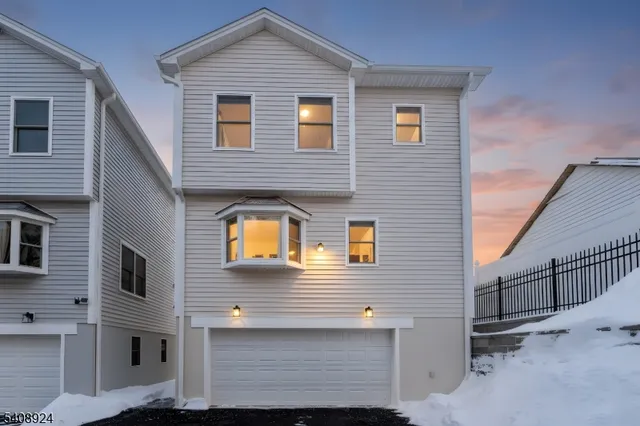 a front view of a house with garage