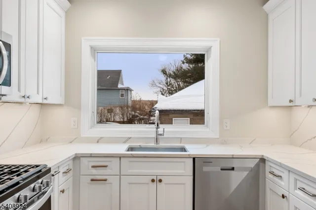 a kitchen with a sink and cabinets