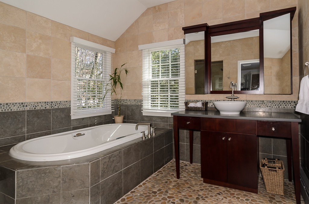 64 Emerson Road Wellesley, MA 02481 - Photo 17 of 21 a spacious bathroom with a granite countertop tub sink and mirror