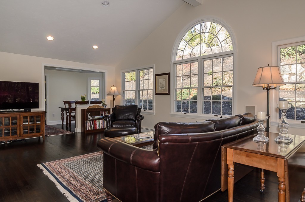 64 Emerson Road Wellesley, MA 02481 - Photo 4 of 21 a living room with furniture and a flat screen tv with wooden floor