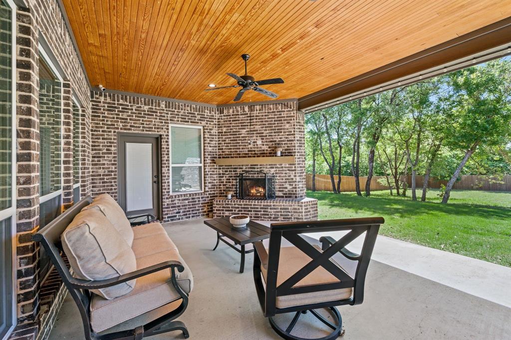 200 Clayton Crossing Springtown, TX 76082 - Photo 32 of 40 a patio with table and chairs