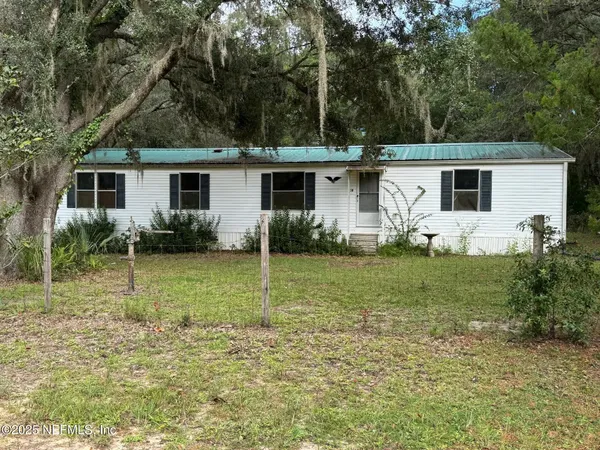 a view of a backyard of the house