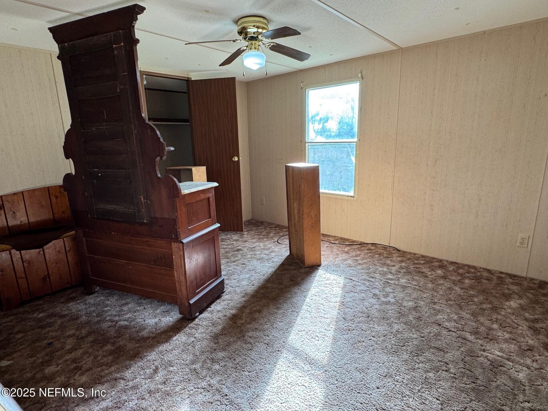 910 O Farrell Avenue Interlachen, FL 32148 - Photo 12 of 19 a view of a hallway with entryway and chandelier
