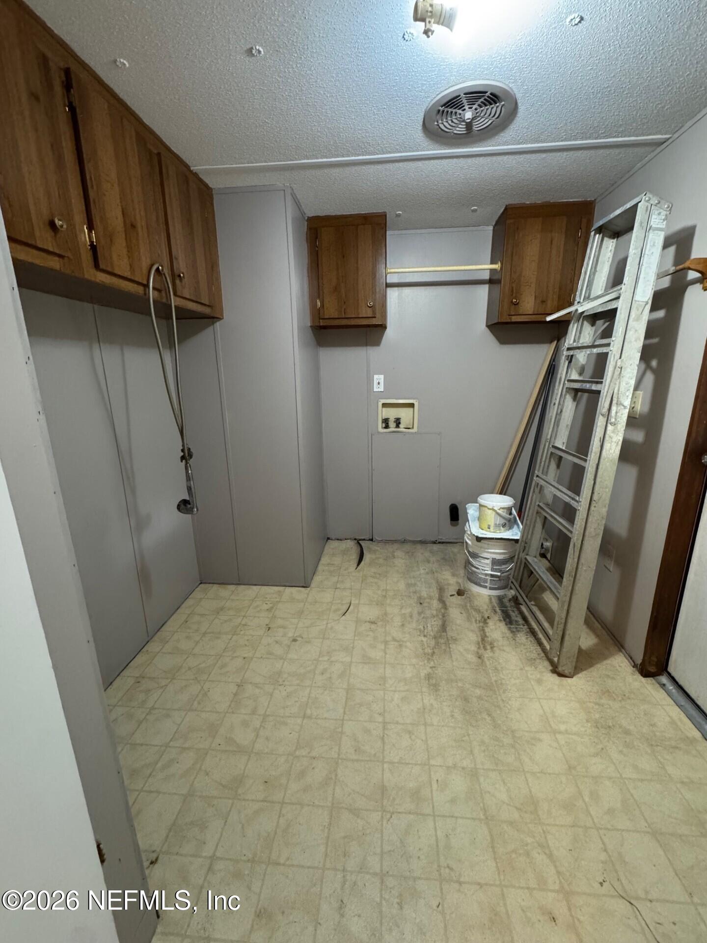 910 O Farrell Avenue Interlachen, FL 32148 - Photo 13 of 19 a bedroom with a bed and a flat screen tv