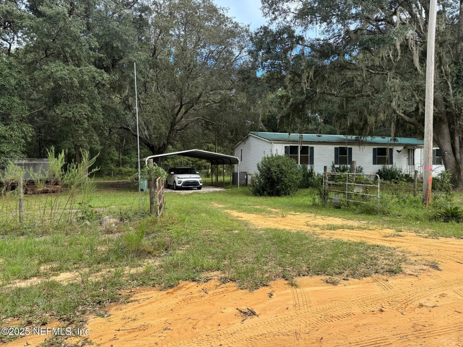 910 O Farrell Avenue Interlachen, FL 32148 - Photo 15 of 19 a backyard of a house with lots of green space