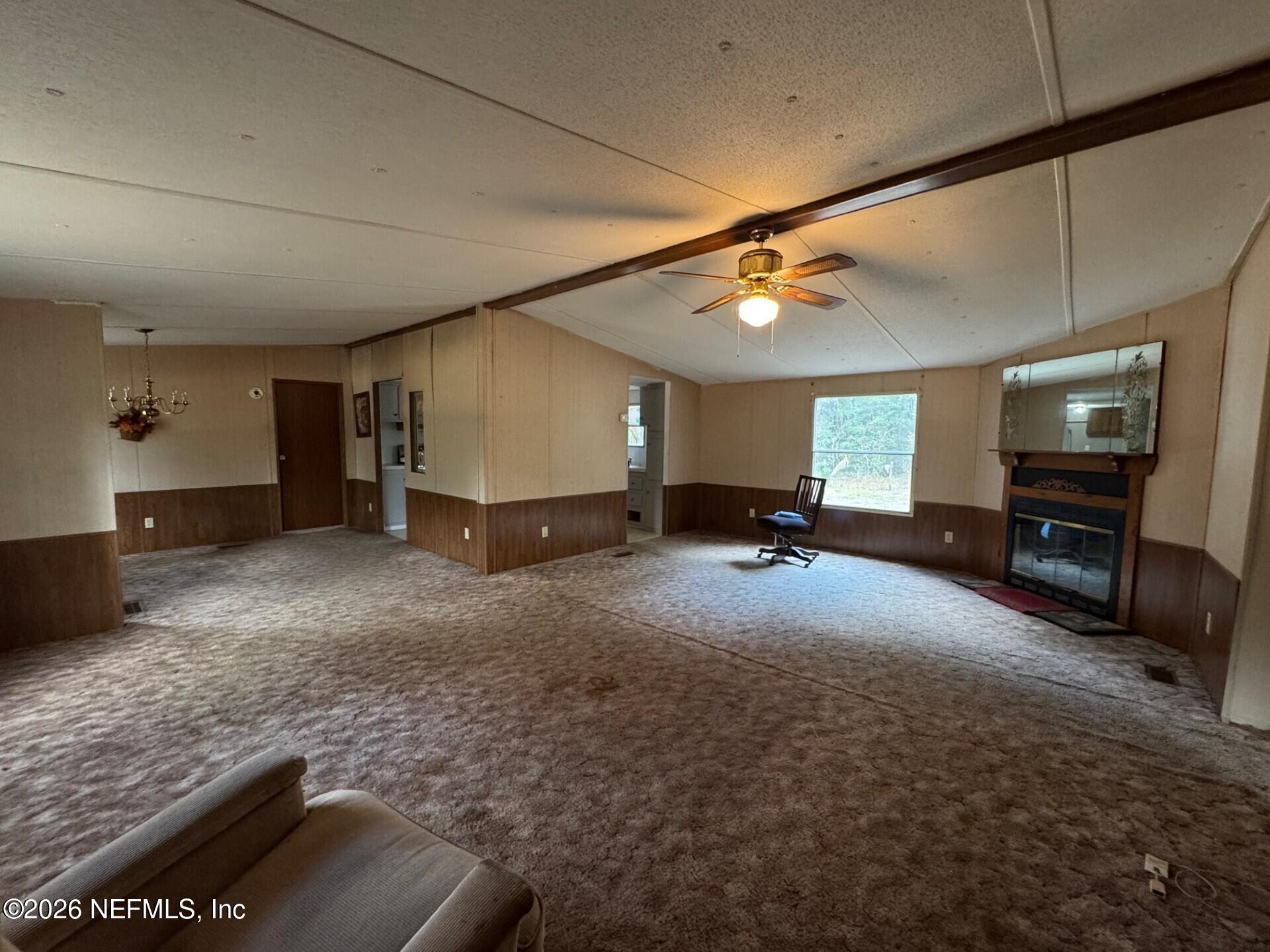 910 O Farrell Avenue Interlachen, FL 32148 - Photo 2 of 19 a living room with furniture and a flat screen tv