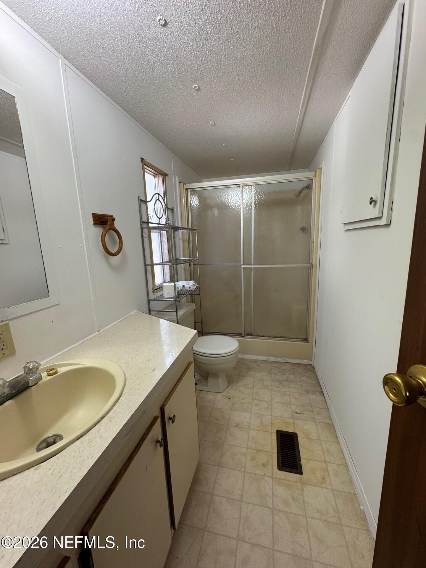 910 O Farrell Avenue Interlachen, FL 32148 - Photo 9 of 19 a bathroom with a sink toilet and shower