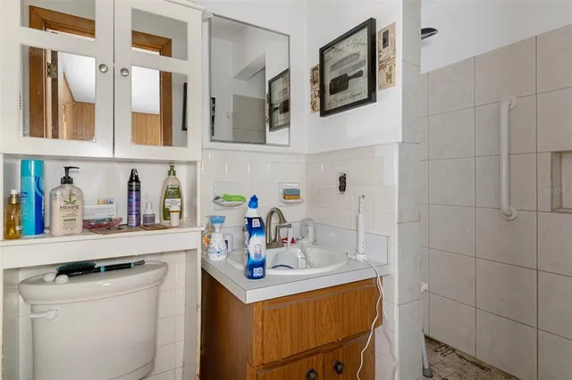 a utility room with cabinets washer and dryer