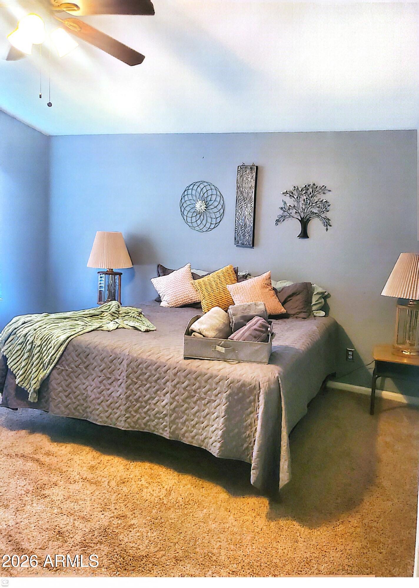 11058 East Cholla Road Mesa, AZ 85207 - Photo 15 of 22 a bedroom with a bed and a lamp on table