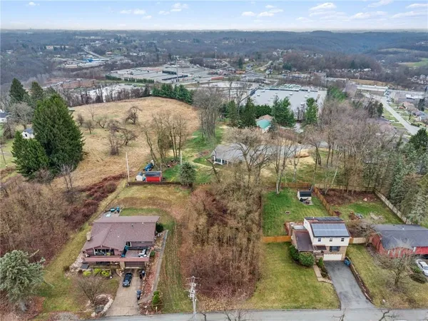 an aerial view of a house with a garden