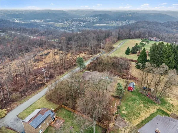 an aerial view of residential house with outdoor space