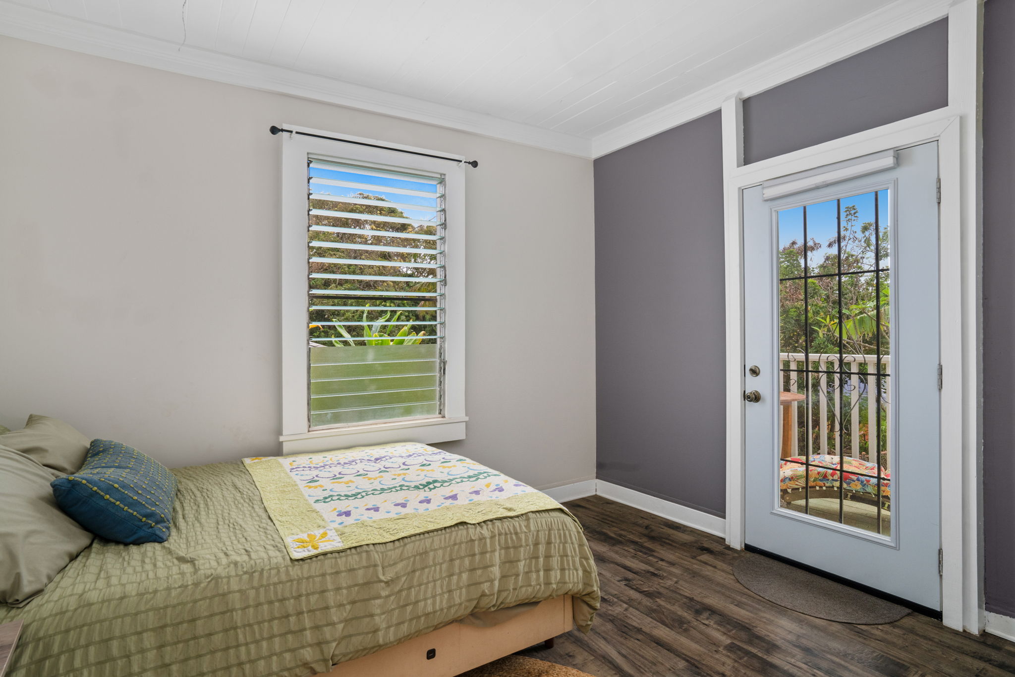 4780 Iiwi Road, Unit 1 Kapaa, HI 96746 - Photo 13 of 24 a bedroom with a bed and a window