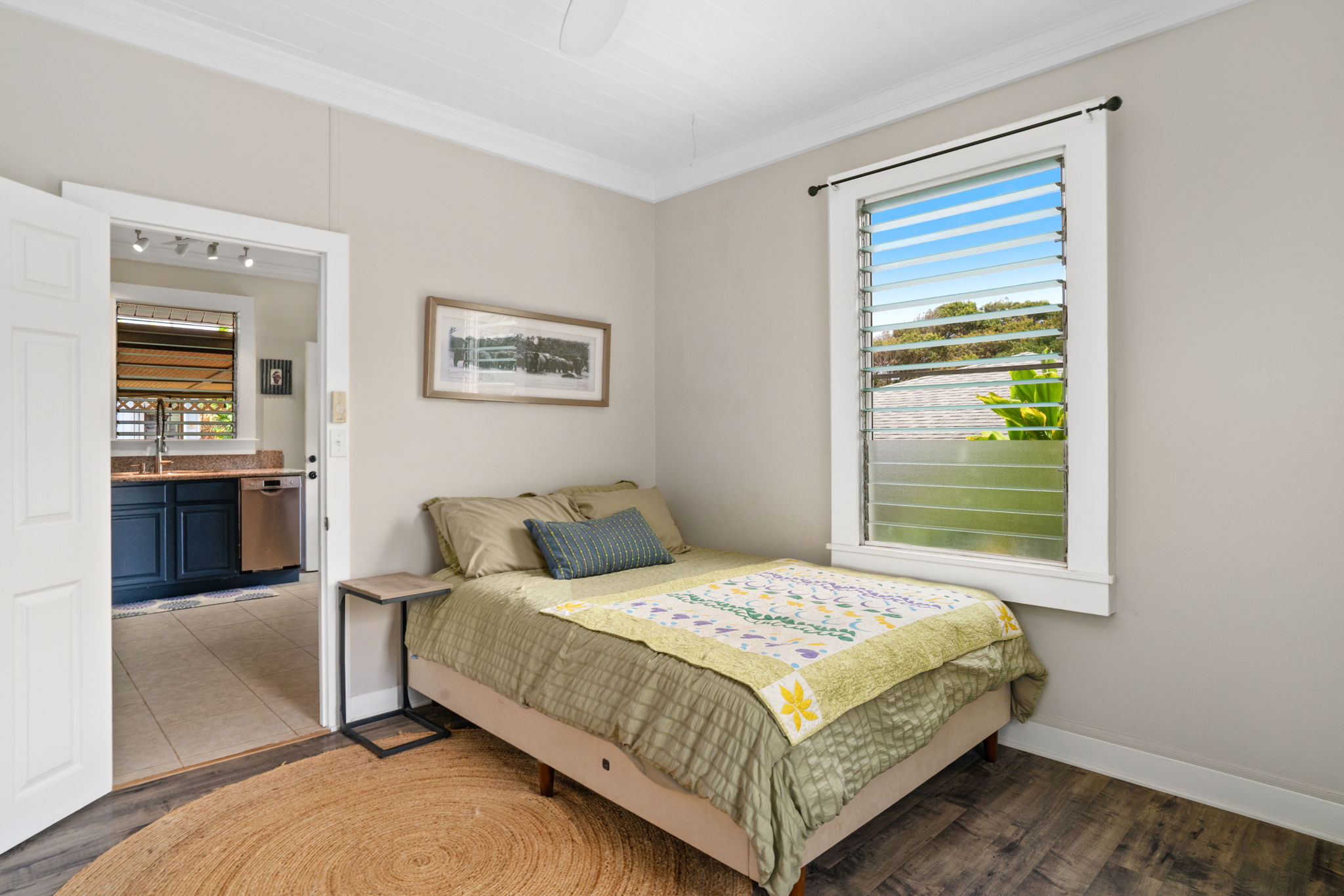 4780 Iiwi Road, Unit 1 Kapaa, HI 96746 - Photo 14 of 24 a bedroom with a bed and window