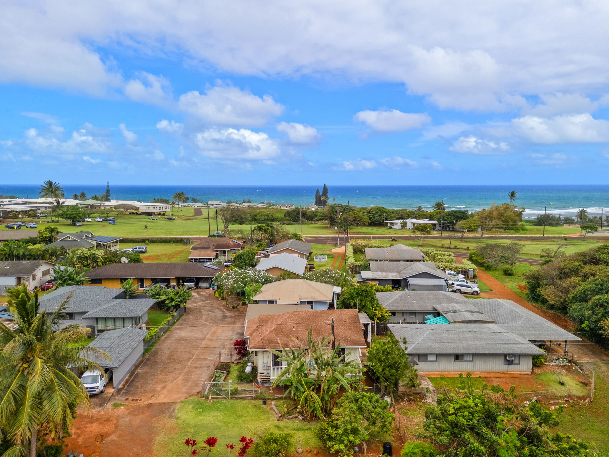 4780 Iiwi Road, Unit 1 Kapaa, HI 96746 - Photo 16 of 24 an aerial view of a city with lots of residential buildings ocean and mountain view in back