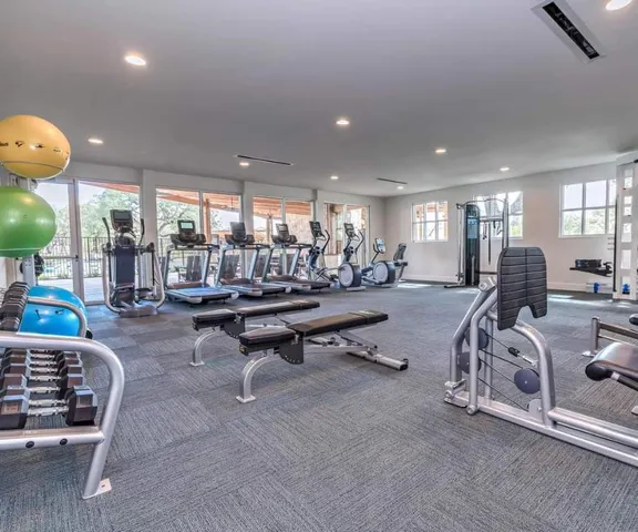 a room with lots of furniture and a chandelier