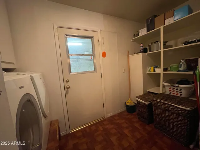 a view of kitchen and utility room with washer and dryer