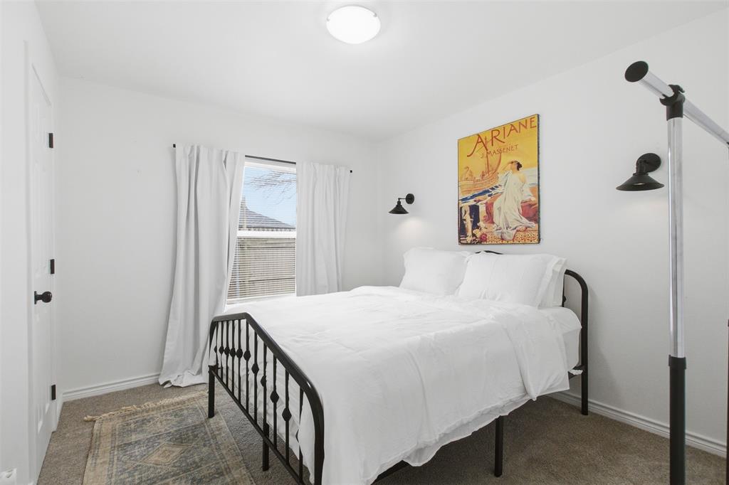 9112 Shiloh Road Dallas, TX 75228 - Photo 11 of 23 a bedroom with a bed and a window