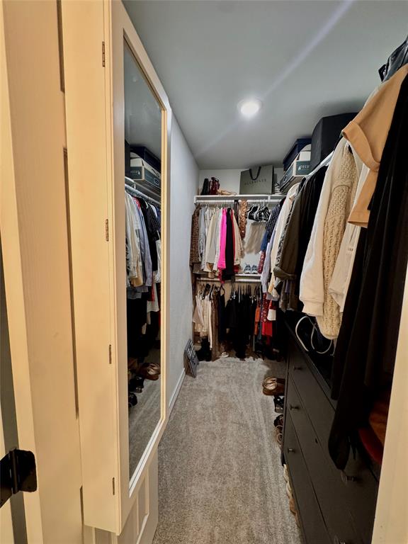 9112 Shiloh Road Dallas, TX 75228 - Photo 12 of 17 a view of walk in closet with clothes and shoes