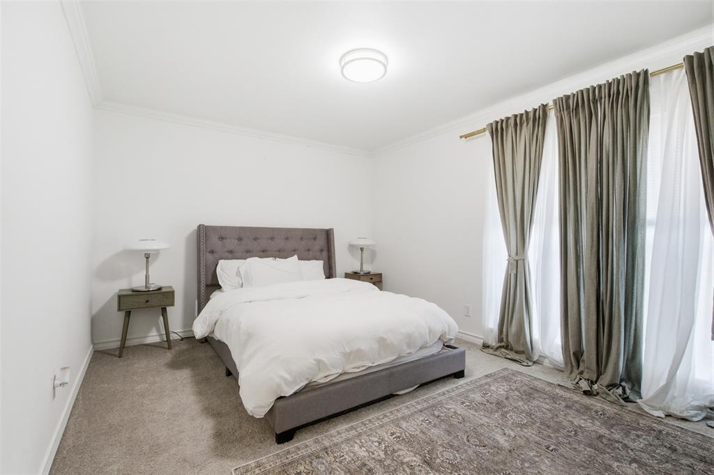9112 Shiloh Road Dallas, TX 75228 - Photo 12 of 23 a bedroom with a bed and a window