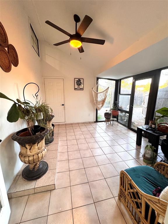 9112 Shiloh Road Dallas, TX 75228 - Photo 15 of 17 a room with furniture a flat screen tv and a floor to ceiling window