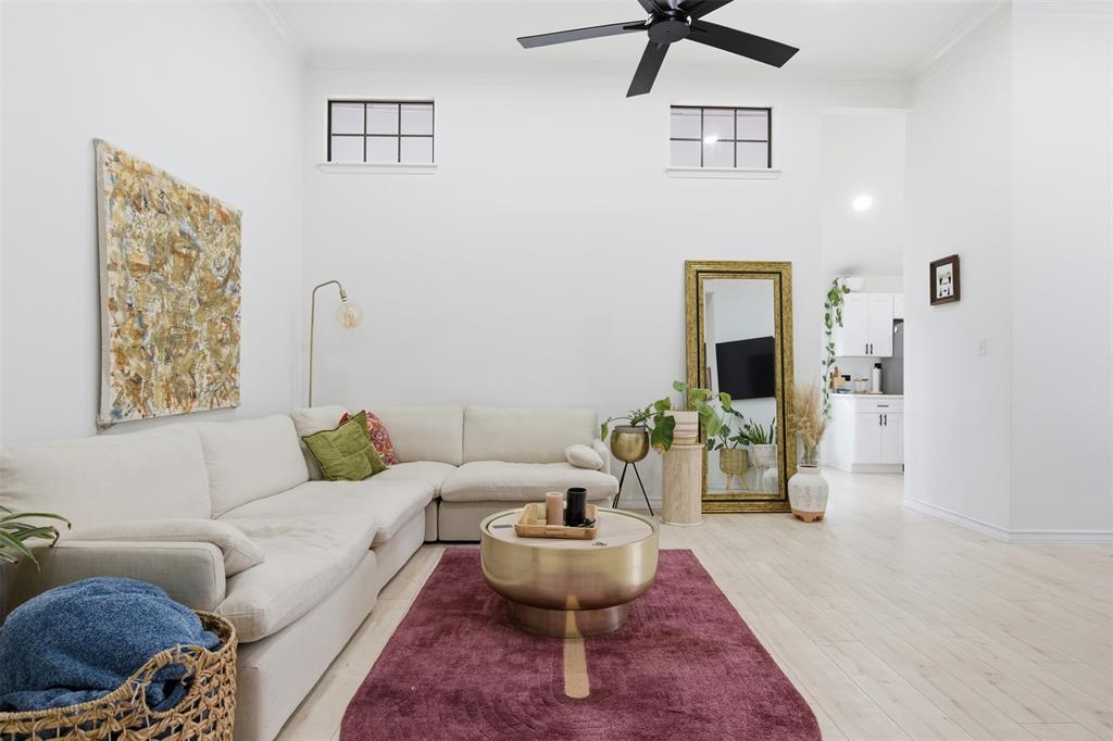 9112 Shiloh Road Dallas, TX 75228 - Photo 2 of 23 a living room with furniture and a chandelier