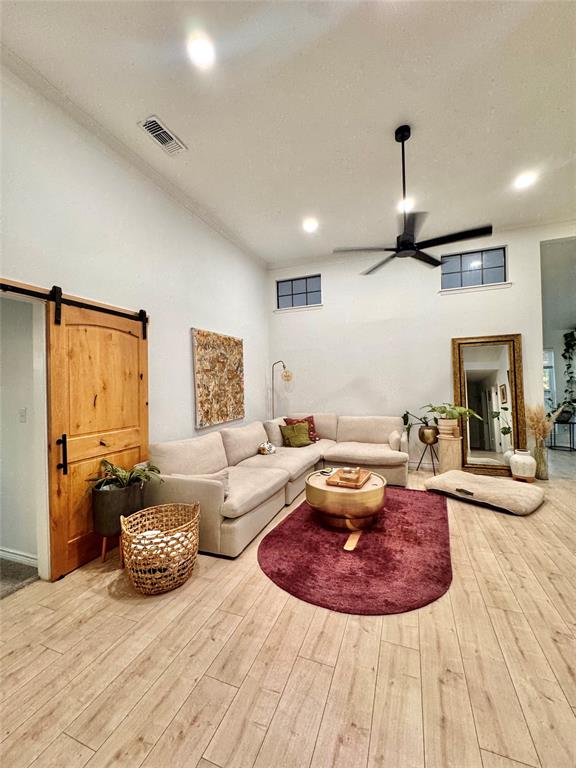 9112 Shiloh Road Dallas, TX 75228 - Photo 2 of 17 a living room with furniture and a fireplace