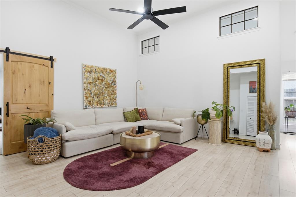 9112 Shiloh Road Dallas, TX 75228 - Photo 3 of 23 a living room with furniture and wooden floor