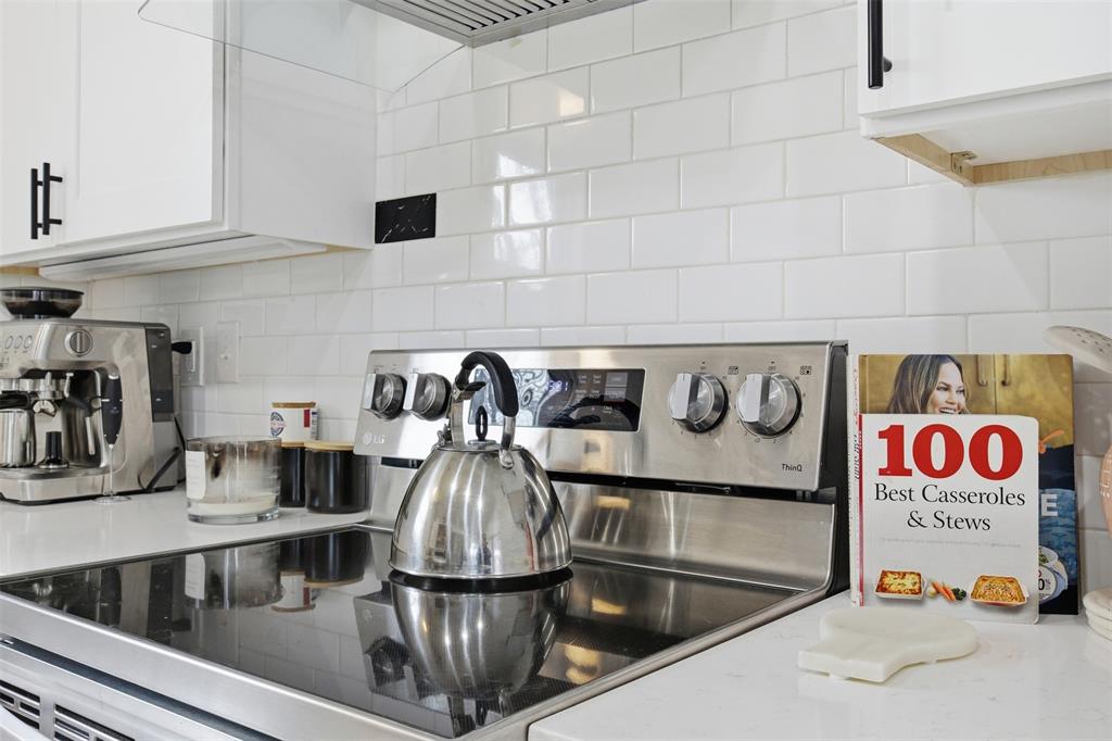 9112 Shiloh Road Dallas, TX 75228 - Photo 7 of 23 a kitchen with a stove and a sink
