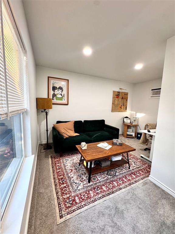 9112 Shiloh Road Dallas, TX 75228 - Photo 8 of 17 a living room with furniture rug and window