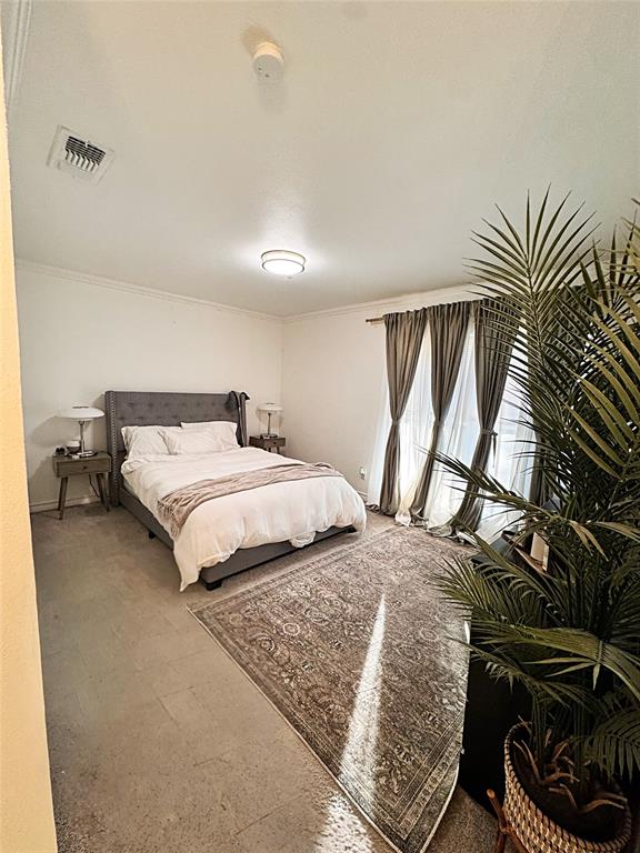 9112 Shiloh Road Dallas, TX 75228 - Photo 9 of 17 a bedroom with a bed and a window