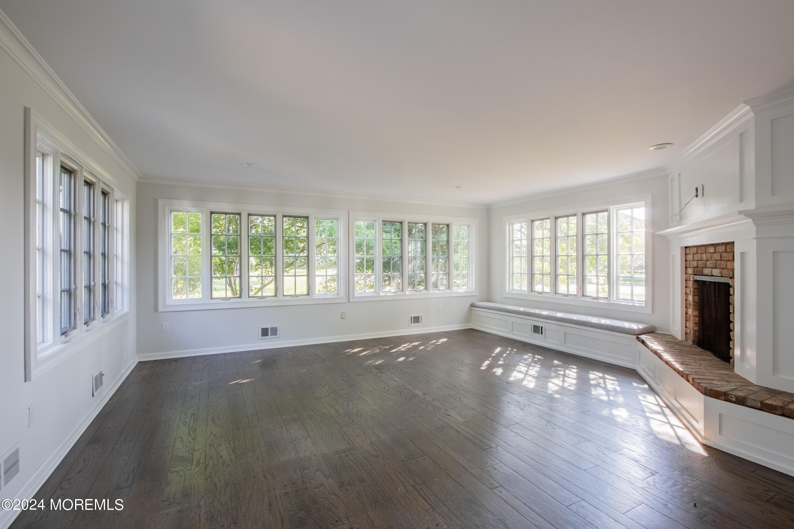 67 Rivers Edge Drive Little Silver, NJ 07739 - Photo 15 of 40 a view of an empty room with a window and wooden floor