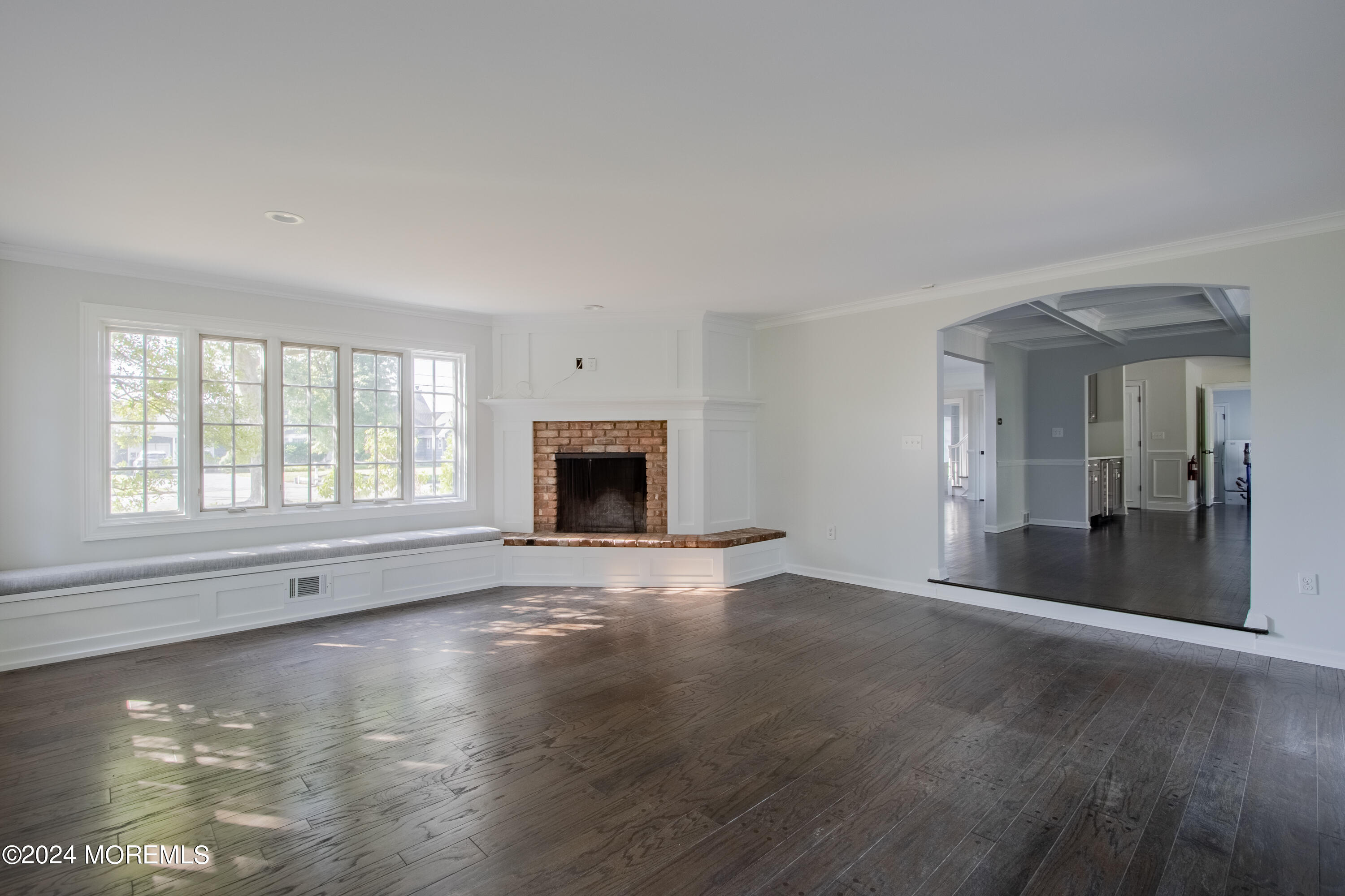 67 Rivers Edge Drive Little Silver, NJ 07739 - Photo 17 of 40 an empty room with floor to ceiling windows and fireplace