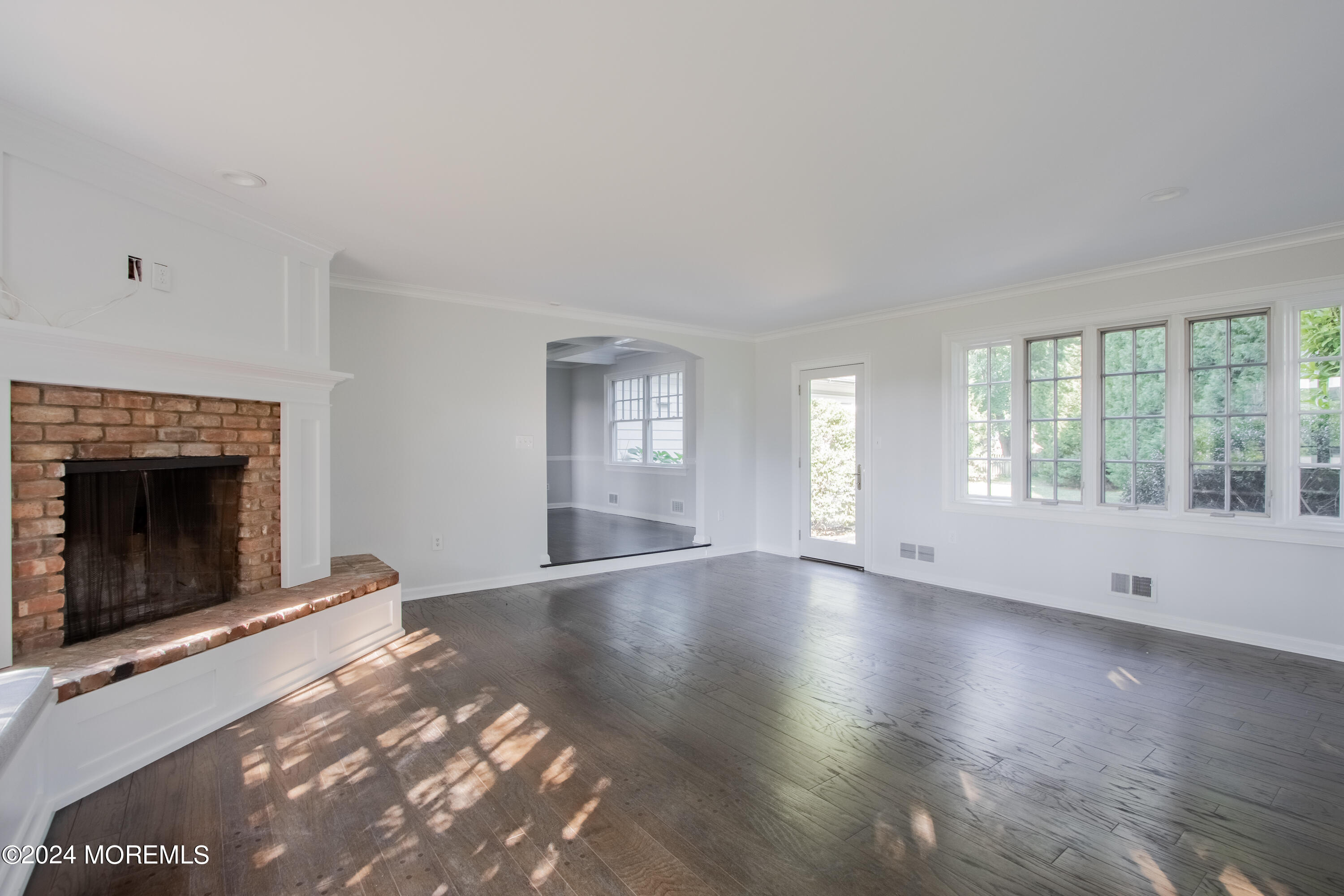 67 Rivers Edge Drive Little Silver, NJ 07739 - Photo 18 of 40 wooden floor fireplace and windows in an empty room