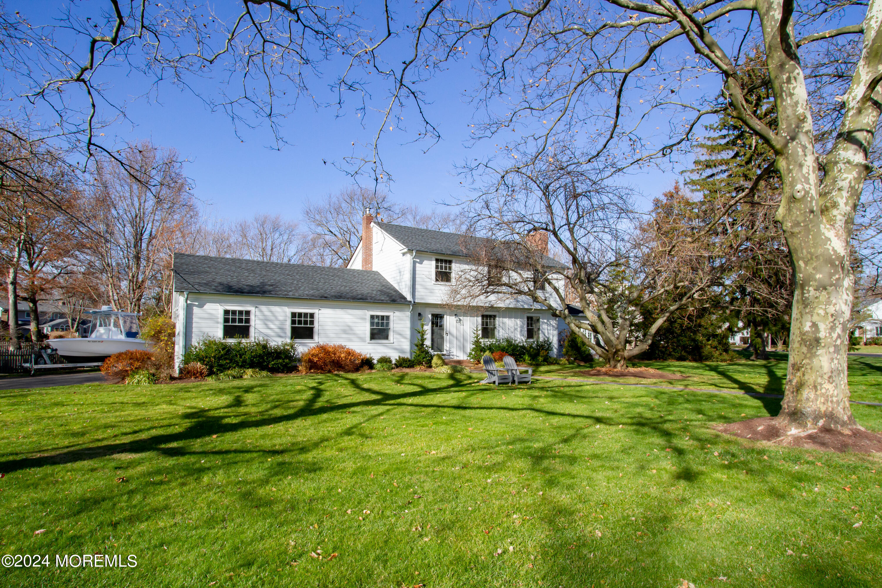 67 Rivers Edge Drive Little Silver, NJ 07739 - Photo 2 of 40 a front view of a house with a garden and trees