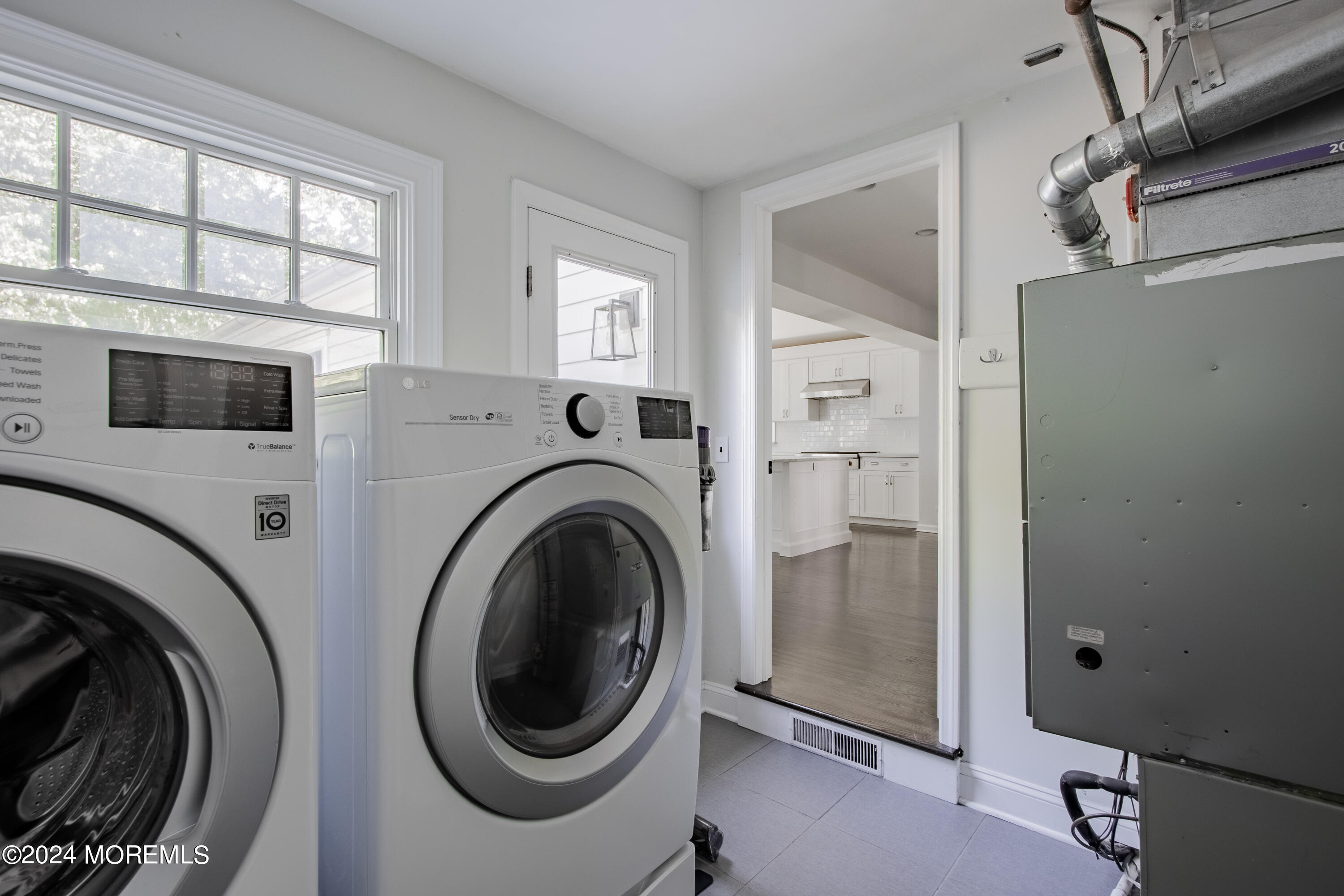 67 Rivers Edge Drive Little Silver, NJ 07739 - Photo 21 of 40 a view of a hallway with washer and dryer