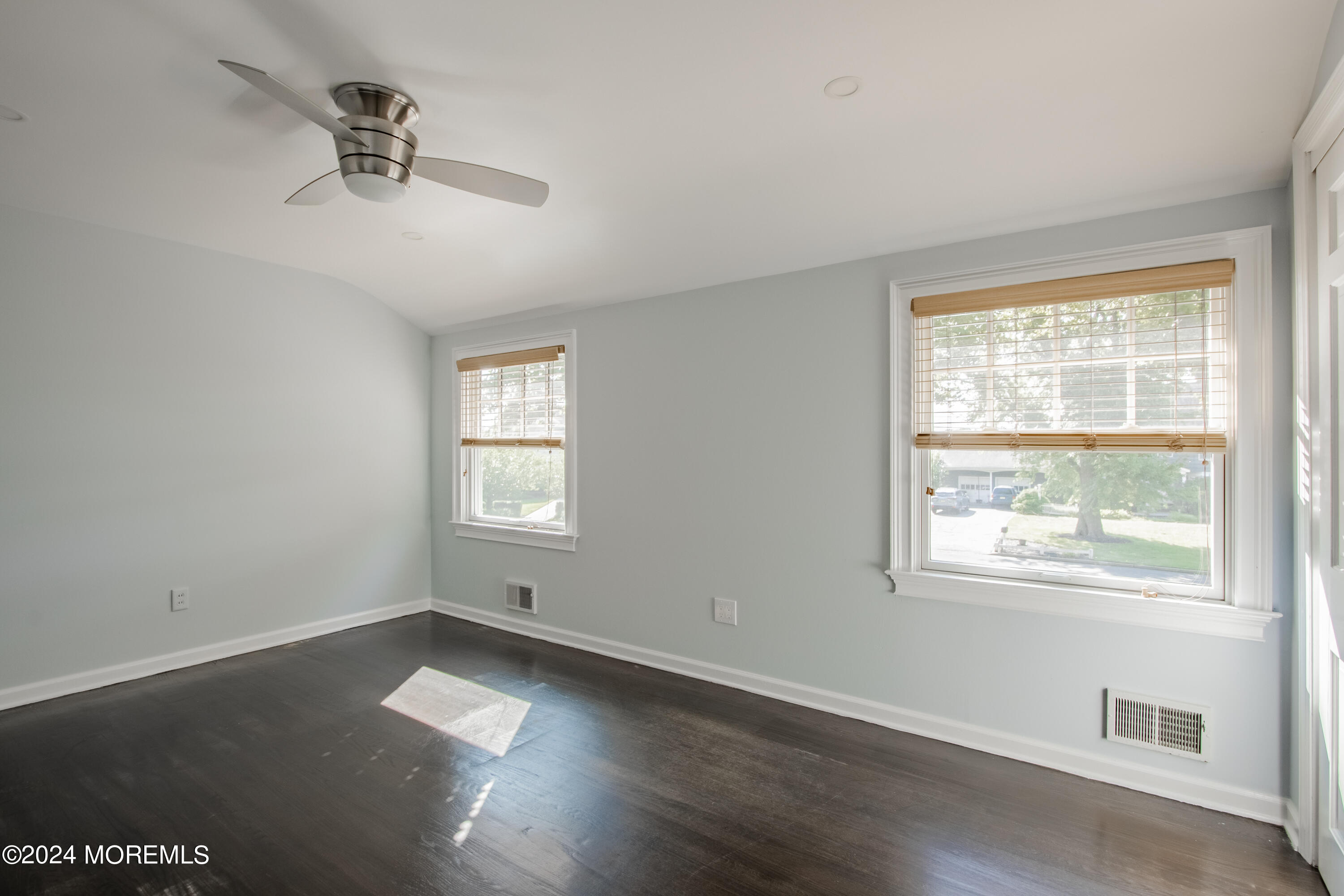 67 Rivers Edge Drive Little Silver, NJ 07739 - Photo 22 of 40 a view of an empty room with wooden floor and a window