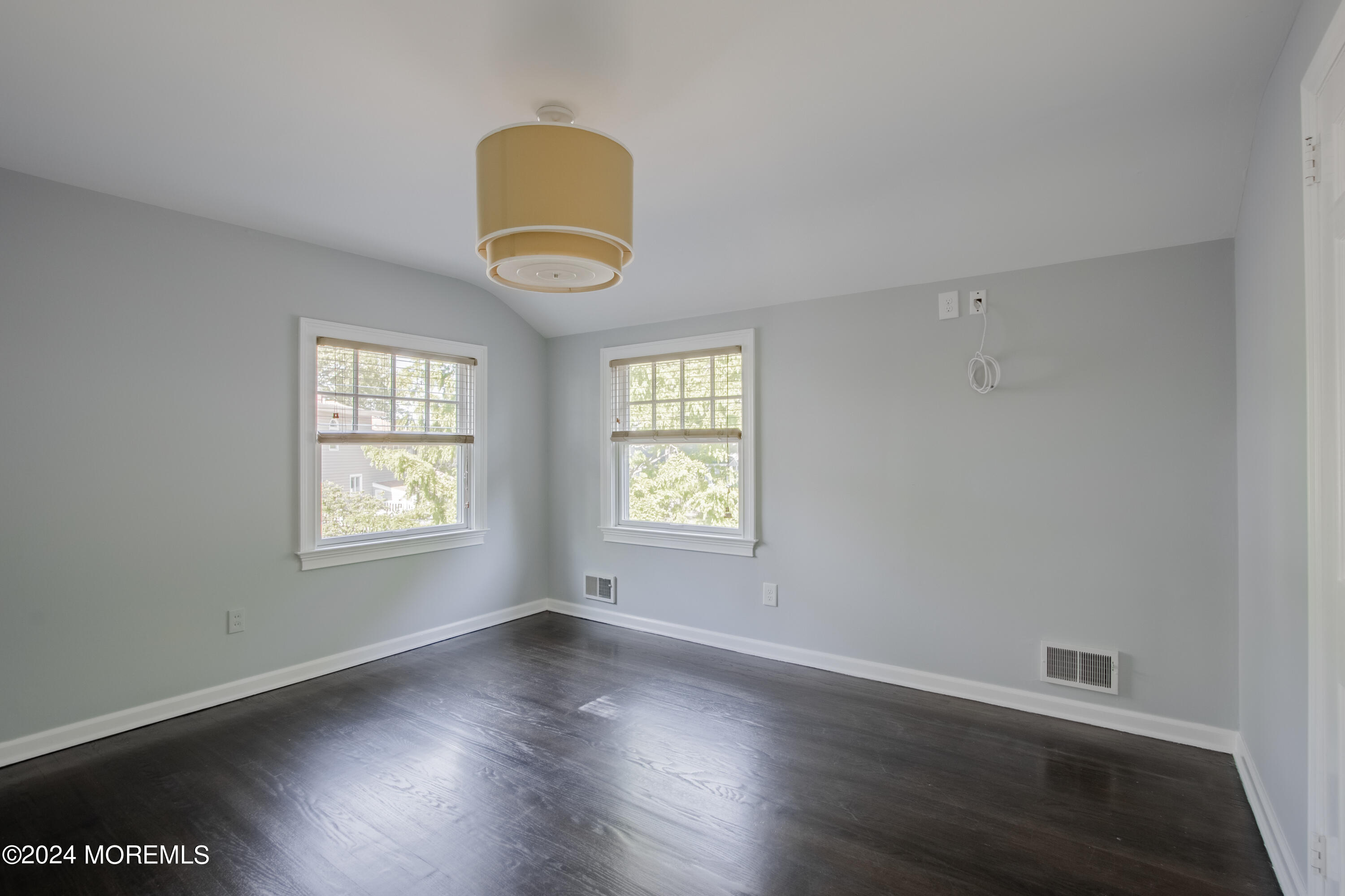 67 Rivers Edge Drive Little Silver, NJ 07739 - Photo 23 of 40 a view of an empty room with wooden floor and a window