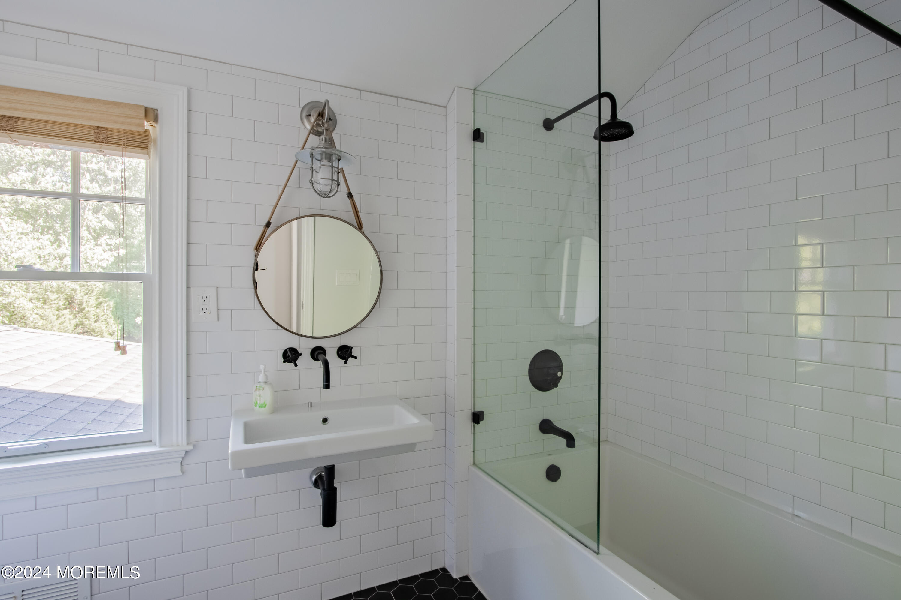 67 Rivers Edge Drive Little Silver, NJ 07739 - Photo 26 of 40 a bathroom with a sink a mirror and shower